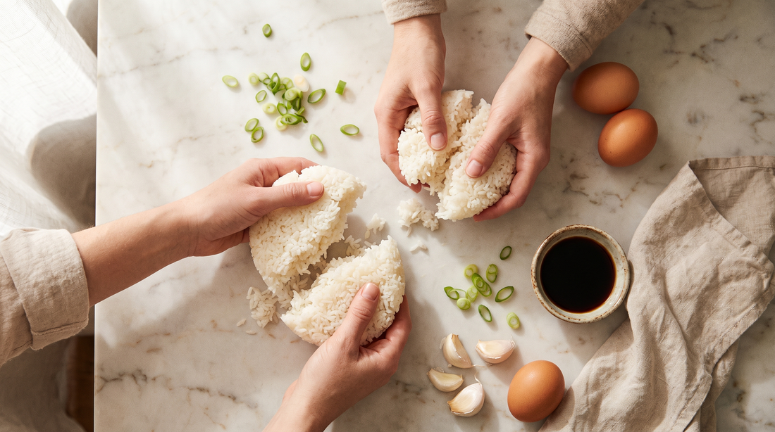 Hands breaking up chilled rice with scallions and eggs, prep for restaurant style fried rice at home