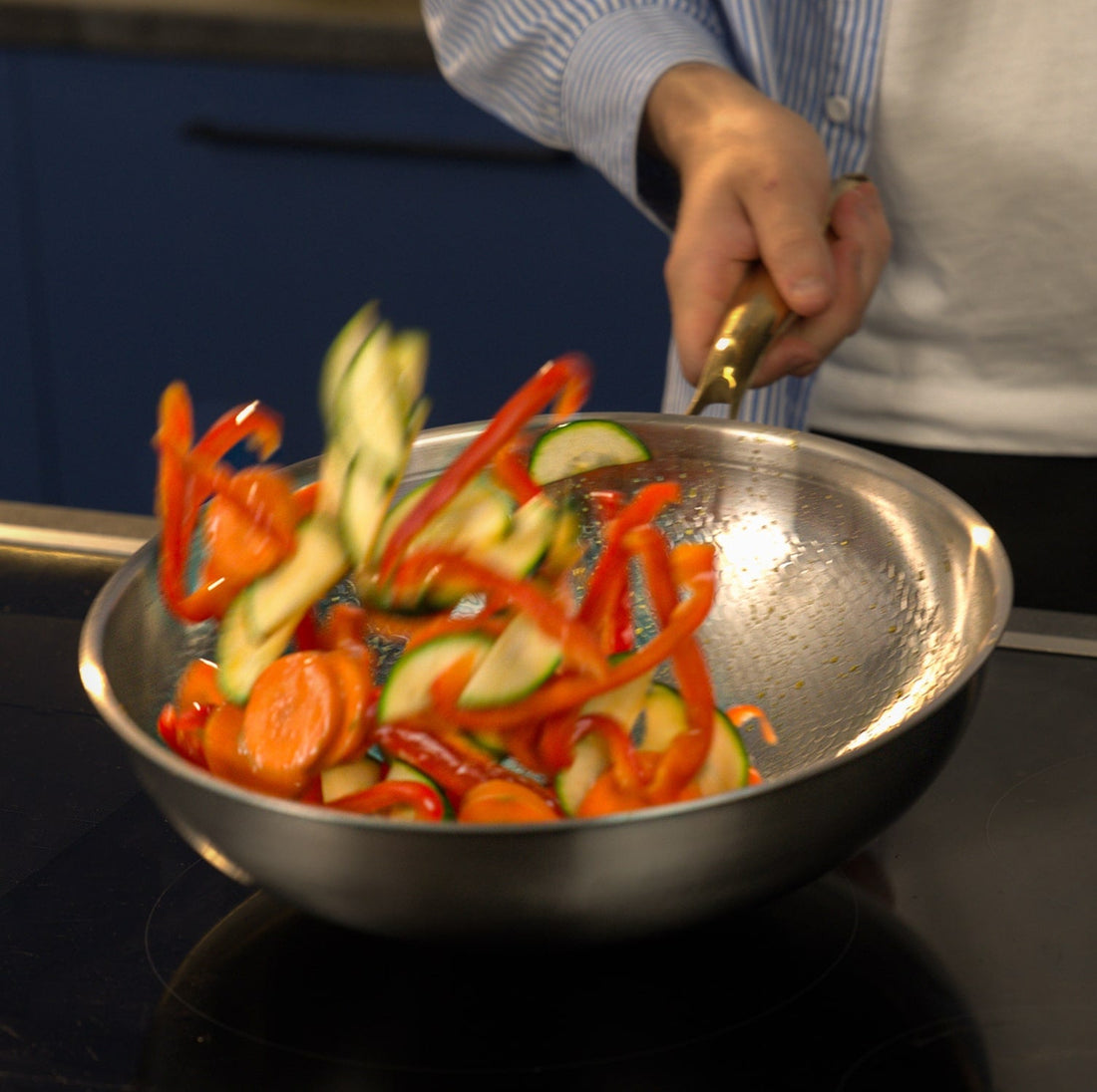 Pure titanium wok used to cook fried rice over high heat